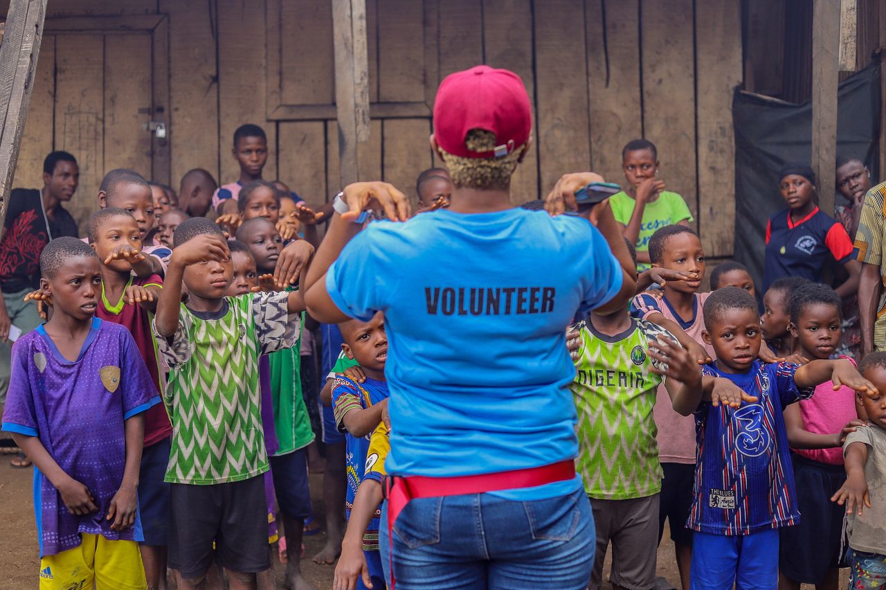 Volunteers working with children in the community